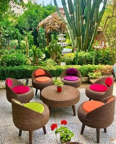 an outdoor seating area with chairs and tables