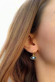 hoop earringsgold hoop earringsdangle earringshuggie hoop earringsclip on earringsgold evil eyeevil eye earringsgold earringsdrop earringsgift for hervintage earringssmall hoop earringselegant earrings evil eye jewelryEvil eye hoop earringsThis cute earrings are made from steell and they are 24k gold plated.You can choose between 4 different clasps (the numbers 1 and 2 are for non pierced ears) and between 2 styles (transparent, black).They are very light and comfortable!Plus they are anti aller Trendy 14k Gold Filled Dangle Jewelry, Trendy Handmade Gold Plated Jewelry, Trendy Handmade Gold Jewelry, Gold Evil Eye Drop Earrings, Trendy Gold Plated Earrings For Gifts, Trendy 14k Gold Filled Drop Earrings, Trendy 14k Gold-filled Drop Earrings, Trendy Gold Plated Nickel-free Jewelry, Dainty Single Hoop Earring In Metal