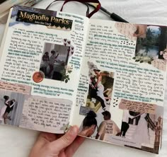 a hand holding an open scrapbook with pictures and words on it, in front of a pair of reading glasses