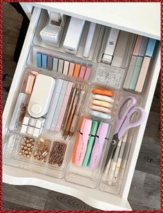 an organized drawer filled with office supplies