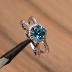 Swiss blue topaz ring wedding ring sterling silver ring November birthstone ring round cut gemstone Blue Topaz Rings, Wedding Rings Emerald Cut, Topaz Rings, Elegant Rings, Swiss Blue Topaz Ring, November Birthstone Ring, Green Amethyst Ring, Sterling Silver Wedding Rings, Swirl Ring