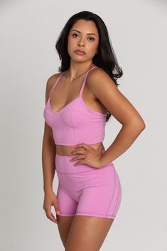 Our Light Magenta Sports Bra Top is such a stunner. Double lined for maximum coverage with removable padding for extra support. The bustier design is ultra-trendy, making this the perfect sports bra for your hardest workout class. Padded Nylon Sports Bra With High Stretch, High Stretch Padded Nylon Sports Bra, Padded High Stretch Yoga Activewear, Fitted Activewear With Built-in Padding And Tank Straps, High Stretch Padded Yoga Activewear, Padded High Stretch Sports Bra For Training, High Stretch Padded Sports Bra For Workout, Fitted Push-up Sports Bra With Medium Bust Support, Fitted Nylon Sports Bra With Built-in Padding