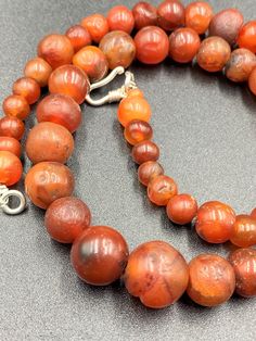 The Beautiful Roman's Era Dynasty Red Carnelian Agate Stone Jewelry Beads Necklace. The Age Of This Beads Are More Than 2000 Years Old. Conditions Of Beads As Shown In The Pictures. Rich In Patina. Natural Carnelian Gemstones, Polished Round Carnelian Beads Jewelry, Artisan Carnelian Round Beads Necklace, Round Carnelian Beads For Jewelry Making, Carnelian Gemstone Round Beads, Red Carnelian Round Beads, Round Carnelian Necklace With Polished Beads, Carnelian Polished Beads Necklace, Carnelian Gemstone Beads Necklace