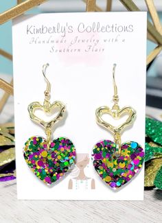 Purple, green and gold Mardi Gras heart dangle earrings. Made with glittervand resin. Lightweight,  hang about 2in. from ear. Ships free, will come gift wrapped. Green Heart Earrings For Valentine's Day Party, Handmade Green Earrings For Valentine's Day, Green Nickel-free Heart Earrings As Gift, Green Heart Drop Earrings For Gifts, Green Heart-shaped Earrings For Gifts, Green Heart Beads Earrings For Gift, Green Earrings With Heart Beads For Gifts, Nickel Free Green Heart Earrings, Nickel-free Green Heart Earrings