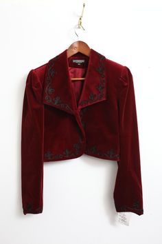 Elevate your style with this stunning Rare New J. Peterman velvet bolero jacket. The rich red color and intricate embroidered accents make it perfect for any occasion, from casual to formal. The long sleeves and collared neckline provide added warmth during the fall and winter seasons. This vintage piece is made with high-quality cotton velvet and lined with acetate for a comfortable fit. The short jacket length and solid pattern give it a classic, preppy vibe that is perfect for city or travel wear. Whether you're looking for a statement piece for a party or cocktail event, or simply want to add some designer flair to your workwear, this bolero jacket is sure to impress. Drummer Oc, Velvet Jacket Outfit, Velvet Bolero, Red Velvet Jacket, J Peterman, Velvet Clothes, Velvet Shorts, Travel Wear, Skating Outfits