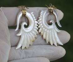 Wings earrings hand made MOP shells set in brass,  price per pair Please have a look at Photos, colors may a little bit vary from the actual look, and due to Monitor Displayed settings and lighting when shoot with camera. SIZE please have a look at images for detail dimensions, size and weights. MAKE SURE YOU WANT THE WEIGHTS AND DIMENSIONS OF THE PRODUCTS SHOWED AT IMAGES URGENT AND IMPORTANT  THIS IS MANDATORY  NEW PROCEDURE FROM POST OF INDONESIA, ALL INTERNATIONAL SHIPMENT MUST INCLUDE CONSIGNEE PHONE NUMBER,ALL SHIPMENT WILL BE FORWARDED BY ( DHL) AT RECIPIENT COUNTRY. SO PLEASE LEAVE A NOTE OR INBOX ME YOUR PHONE NUMBER WHEN DO PURCHASE.OTHERWISE ,I CAN NOT SHIP THE ORDER WITHOUT CONSIGNEE NUMBER IN THE INVOICE. ALL INTERNATIONAL SHIPMENT WILL BE FORWARDED BY ( DHL ) AT YOUR COUNTRY, Wings Earrings, Wing Earrings, Phone Number, Jewelry Earrings Dangle, Dangle Drop Earrings, Dangle Earrings, Shells, Jewelry Earrings, Accessory Gift