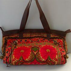 Embroidered Floral Bag With Real Leather Trim. Zipper Closure, Inside Pocket. Bell Accent On Sides. Floral Embroidery Throughout Both Sides. Gorgeous Colors! Brand New 18lx12hx3d Inches Yellow Embroidered Travel Bag, Rectangular Shoulder Bag With Floral Embroidery For Travel, Brown Embroidered Rectangular Bag, Floral Embroidered Rectangular Shoulder Bag For Travel, Embroidered Brown Rectangular Satchel, Brown Embroidered Rectangular Satchel, Red Bags With Floral Embroidery For Festivals, Red Floral Embroidery Bag For Festivals, Floral Embroidered Pouch Shoulder Bag For Travel