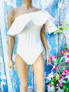 Chic bodysuit that you can match with almost anything. Limited sizes. Comes in small and medium. 100 % Polyester Hand Wash Cold. Chic Off-shoulder Bodysuit For Summer, Chic Fitted Bodysuit With Ruffles, Chic Fitted Ruffles Bodysuit, Stretch Bodysuit With Ruffles, Chic Fitted Ruffled Bodysuit, Fitted Off-shoulder Bodysuit For Summer, Summer Off-shoulder Fitted Bodysuit, Fitted Off-shoulder Solid Bodysuit, Summer Bodysuit With Ruffles