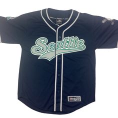 Vintage Seattle Mariners MLB jersey. Made in Korea. Stitched graphic. 90s. High-quality. Deadstock, never worn. Tagged as a medium. 22.5 inches pit to pit, 30 inches long. Excellent vintage condition. Smoke and pet free home. Collegiate Jersey For Streetwear During Sports Season, Throwback Cotton Jersey For Sports Events, Streetwear Cotton Jersey With Team Name, Blue Letter Print Jersey For Streetwear, Cotton Team Jersey For Streetwear, Collegiate Streetwear Jersey Top, Collegiate Jersey Top For Streetwear, Throwback Cotton Jersey With Letter Print, Crew Neck Jersey With Logo Print For Sports Season