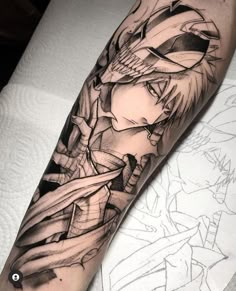 a man's arm with an anime character tattoo on it