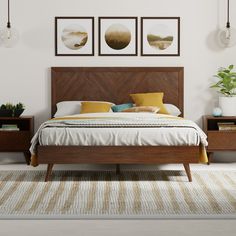 a bed sitting in a bedroom next to two planters on either side of the bed