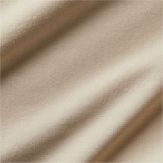 an image of a white fabric textured with some light brown lines in the background