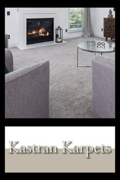 a living room with two couches and a fire place in the fireplace that reads karstan karpets