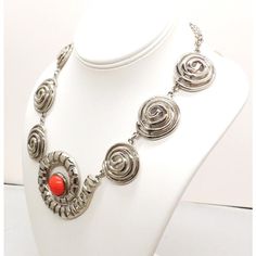 This is part of Chairish’s Costume Jewelry assortment.  1970s Modernist rhodium plated spiral links with cabochon faux-carnelian center and box clasp with a single clear round rhinestone on it necklace. Marked "U.C. Ugo Correani Made in Italy." Center:  2 inches long. Overall measures: 7 1/2 inches long by 5 1/2 inches wide. Interior circumference about 17 1/2 inches. Condition: Very good except that there is crazing to the metal coating on the clasp, which may be a problem at a later date, but Modern Spiral Jewelry For Formal Occasions, Modern Spiral Jewelry For Formal Events, Modern Spiral Metal Jewelry, Formal Metal Cabochon Jewelry, Formal Metal Jewelry With Cabochon, Retro Silver Metal Jewelry, Vintage Spiral Nickel-free Jewelry, Retro Red Metal Jewelry, Retro Round Cabochon Jewelry