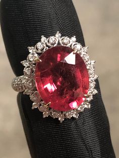 Rubelite Tourmaline Ring- Vintage style Rubelite: 6.65 cts Diamonds: 0.53 cts  G color VS2 18K White Gold 5.27 gr Size: 6.5 ( USA) Colors may slightly differ from pictures.We try our best. Will be shipped fully insured with UPS Formal Ruby Gemstones With Vvs Clarity, Luxury Oval Tourmaline Ring, Elegant Oval Tourmaline Gemstones, Formal Oval Topaz Ring Gia Certified, Gia Certified Oval Topaz Ring For Formal Occasions, Oval Gia Certified Topaz Ring For Formal Occasions, Gia Certified Tourmaline Rings For Formal Occasions, Luxury Tourmaline Rings With Halo Setting, Elegant Tourmaline Gemstone With Center Stone