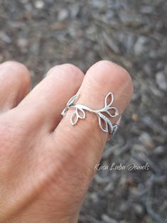 Sterling Silver vine ring, leaves - womens, leaf ring, autumn jewelry, 925 silver jewelry, gifts for mom *IF YOUR SIZE ISNT SHOWING, MESSAGE ME. I might be sold out and will be able to replenish shortly* Top of ring height: 19mm Band width: 9.2mm Metal: 925 sterling silver Plating: rhodium plated Finish: high polish This is a High Polished solid sterling silver ring with Rhodium plating to prevent tarnishing. Nothing but the best from my custom jewelry store. --------------------------- Please follow care instructions. Any rings with stones, regardless where you purchase, must be removed when washing hands or using hair gels or hair creams, and even chemicals and cleaners. To clean jewelry, you can use a toothbrush and some hand soap for simple easy cleaning. This is costume jewelry, not r Elegant Silver Leaf-shaped Ring, Leaf-shaped Jewelry For Gift, Minimalist Sterling Silver Leaf Jewelry, Elegant Silver Leaf Shaped Ring, Minimalist Leaf-shaped Sterling Silver Jewelry, Silver Leaf-shaped Adjustable Jewelry, Leaf-shaped Sterling Silver Jewelry For Anniversary, Nickel Free Leaf-shaped Jewelry, Adjustable Silver Leaf Jewelry