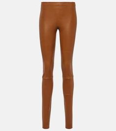 These elegant Blond leather leggings are crafted from supple lamb leather in Portugal. The durable yet comfortable material hugs your curves with an elasticized waistband, while the versatile skinny leg flatters your figure for any Instagram snap. Machine washable for easy care, this versatile and flattering mid-weight legging is true to size to pair with sweaters, boots and more. An investment piece for your fall/winter wardrobe that will seamlessly elevate any outfit. Modern Fitted Leggings For Fall, Fitted Modern Leggings For Fall, Modern Fitted Leather Bottoms, Spring Stretch Leather Pants, Brown Leather Leggings For Fall, Chic Tight Full-length Leather Pants, Chic Tight Full Length Leather Pants, Stretch Brown Leather Trousers, Brown Stretch Leather Trousers