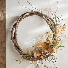 a wreath made out of branches and leaves