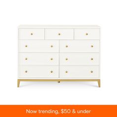 a white dresser with gold knobs on it and the words now trending $ 50 & under