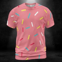 Pink Donut Sprinkles Unisex Comfort T-Shirt. Add some cuteness and fun to your t-shirt collection with this colorful Pink Donut Sprinkles Unisex Comfort T-Shirt design. Features a pink color background with multicolored sprinkles all over the shirt. It looks great on this tee shirt! This design is sure to grab attention. Product Details Step out with an instant classic! Dressed up or down, our unisex t-shirt offers complete comfort and style. Handmade with premium wear-resistant fabric, show off your style with this carefully crafted tee. -95% Polyester And 5% Spandex -4 Way Stretch -Light Fabric -Soft, breathable fabric -Crewneck -Double-needle topstitch detailing -Printed, cut, and handmade   Size & Fit   -Unisex sizing for men and women -Moderate stretch -Sizes: S-5XL Playful Short Sleeve T-shirt With All Over Print, Cute Pink T-shirt With Graphic Print, Pink Funny Print Crew Neck T-shirt, Funny Pink Crew Neck T-shirt, Pink Crew Neck T-shirt With Funny Print, Multicolor Playful T-shirt With Funny Print, Pink Graphic Tee With Crew Neck, Pink Crew Neck Graphic Tee, Playful Colorful Crew Neck T-shirt