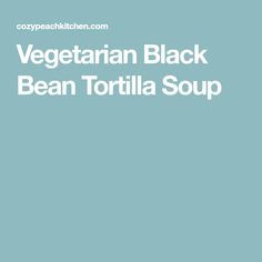 vegetarian black bean tortilla soup in a white bowl on a light blue background