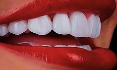 a woman's mouth with white teeth and bright red lip glosses on it