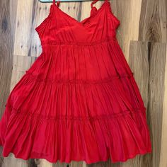 Flowy Thick Material Dress With Open Back And Ties! Red Tiered Midi Dress For Summer, Red Tiered Mini Dress For Brunch, Red Flowy Tiered Midi Dress, Flowy Red Tiered Midi Dress, Red Tiered Midi Dress For Vacation, Red Summer Mini Dress Midi Length, Red Tiered Dress For Spring, Red Tiered Mini Dress For Spring, Red Flirty Sundress For Vacation