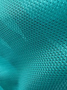 an image of a blue background that looks like it could be woven into something or something