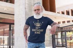 "Men's Birthday King Shirt 50 Year Old Gift Idea 50th Vintage Crown Illustration Royal Sketch Fifty Unisex Tshirt For Men Tee The vintage design on this 50th birthday shirt will never go out of style. A great gift idea for someone turning 50! The design reads '50th Birthday King'. The design features an illustrated sketch of a simple, vintage crown perfect for any king. Let everyone know your king is 50 in this vintage shirt fit for royalty. Perfect for letting everyone know who's celebrating their big 5-0. Printed on super soft ring spun cotton. Includes our signature satin lined drawstring bag. Our model is wearing navy Check out our other Etsy listings: http://shirtsbysarah.etsy.com Check out our other Etsy Shop: https://shirtsbysarahtotes.etsy.com Men's/Unisex Sizing: RUNS SMALL This s Lined Drawstring Bag, Men's Birthday, Crown Illustration, Birthday King, 50th Birthday Shirts, Turning 50, King Shirt, Tshirt For Men, Vintage Crown