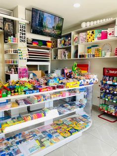 there are many items on the shelves in this store that is filled with children's toys