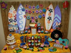 a surfboard themed birthday party with food and decorations