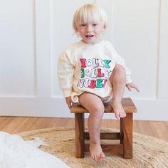 Get into the festive spirit with our Holly Jolly Vibes Christmas Sweatshirt Romper! This adorable romper combines the cozy comfort of a sweatshirt with the fun and whimsy of a holiday outfit. Perfect for holiday parties, family gatherings, or just lounging around the house during the holiday season. The Holly Jolly Vibes Christmas Sweatshirt Romper features a cute and festive holiday design that is sure to spread cheer wherever you go. Made from high-quality materials, this romper is as durable