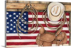 an american flag with a cowboy's hat and lasso hanging on the wall