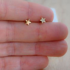 Tiny, plain minimalist star earrings! Perfect for a dainty look or on multiple piercings! ►► Details ▸ Measures 5mm x 5mm ▸ Made of 925 Sterling Silver plated in 14k Gold, 14k Rose Gold, or Rhodium ▸ We use a THICK plating for piece that will last you years to come ▸ Sold as a PAIR ▸ Push back closure ▸ Nickel-free ▸ Hypo-allergenic ✈️Ships outs SAME DAY for fast delivery. Domestic Orders are delivered at your doorstep in 2-3 days! 🎁Packaged in a white gift box, ready for gift-giving! If you ha Hypoallergenic Star-shaped Everyday Earrings, Hypoallergenic Star Earrings For Everyday, Everyday Hypoallergenic Star Earrings, Minimalist Star Charm Earrings For Everyday, Minimalist Star Charm Earrings, Dainty Tiny Star Earrings, Tiny Star Earrings For Everyday, Tiny Star Earrings For Everyday Wear, Minimalist Star Earrings For Everyday