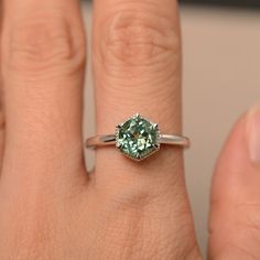 This is a gorgeous handmade creation. Its beauty is its simplicity & Elegance. The 7*7mm round cut lab green sapphireis crafted in solid sterling silver and with rhodium plated. All item is sent in a beautiful gift box You can realize more lovely stuff clicking the link https://www.etsy.com/shop/knightjewelry?refshopsection_shophome_leftnav Please leave the correct address and you phone number for delivering successfully. Green Sapphire Ring With Center Stone As A Gift, Emerald Ring With Center Stone For May Birthstone, Round Emerald Ring With Sapphire Accent Stones, Tourmaline Round Cut Jewelry With Prong Setting, Fine Jewelry Green Sapphire Ring With Prong Setting, Green Sapphire Ring With Accent Stones For Promise, Green Sapphire Promise Ring With Accent Stones, Green Sapphire Ring With Accent Stones As A Gift, Green Sapphire Ring For May Birthstone