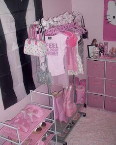 a pink room with lots of clothes and accessories