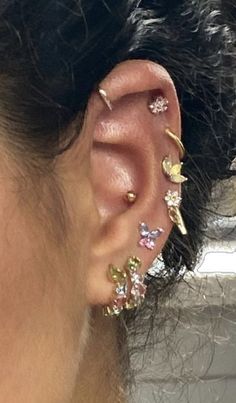 a close up of a person with ear piercings