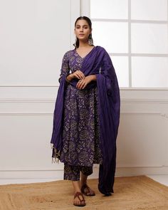 Add a touch of elegance to your wardrobe with our Violet Hand Block Printed Mul-Mul Suit Set. Made with high-quality mul-mul fabric and adorned with traditional Indian hand block printing, this striking violet suit set is perfect for any season. Complete the look with the matching dupatta for a stylish impact. No. of piece - 3 piece set. Color - Violet. Fabric - Mul-Mul. Washing Instructions - Dry Clean. Traditional Silk Palazzo Set With Block Print, Traditional Silk Palazzo Set With Bandhani Print, Designer Silk Kurta With Block Print, Designer Block Print Kurta With Traditional Drape, Traditional Drape Block Print Kurta For Eid, Designer Wear Kurta With Block Print And Traditional Drape, Traditional Drape Kurta With Block Print For Eid, Traditional Palazzo Set With Block Print, Eid Block Print Kurta With Traditional Drape