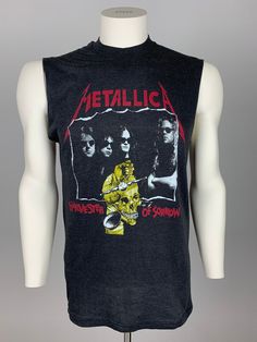 a black tank top with metallichead on it