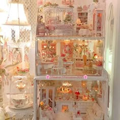 a doll house with lots of furniture and accessories