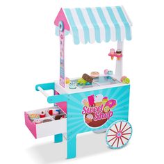 a toy ice cream cart with wheels on the front and an awning over it