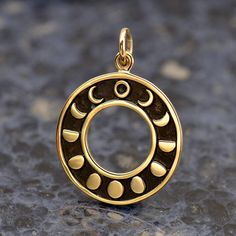 Circular Moon Phases Pendant. This etched and oxidized celestial jewelry charm represents all of the lunar phases as the moon waxes and wanes. The center is a cut out circle, as if it were representing a lunar eclipse, as the different profiles of the moon form a ring around the center from New Moon to Full Moon. Each phase of the moon has its own associated meaning. New moons are for beginnings, for example, while the waning moon is believed to be a good time for banishing things, or clearing n Gem Necklaces, Moon Phase Jewelry, Moon Phase Ring, Phase Of The Moon, Waning Moon, Lunar Phases, Starry Starry Night, Travel Charms, Phases Of The Moon