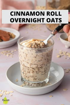 a person holding a spoon over a bowl of oatmeal with cinnamon roll overnight oats in it