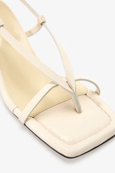 Strappy sophistication. Our Greta Sandals feature a modern square toe and an adjustable slingback strap for a flattering look, enhanced by a chic kitten heel and minimalist raw edges. Whether it's running between meetings or dancing the night away, their padded soles and soft Italian leather let you do it all in comfort—and impeccable style.[SPLIT] Astrid wears Greta in cream, in disco, and in black. Heel height is approximately 2" (5 cm). Sold in US sizes, though please note that shoes may be l Black Heel, Modern Square, Work Week, The A Team, Kitten Heel, Health Insurance, Comfort Style, Italian Leather, Leather Sandals