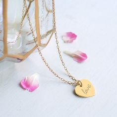 Perfect for Valentine's Day or for the bride on her big day, our beautiful gold heart necklace has the word 'love' in a script font engraved on the front. It can be personalised on the reverse with a date or wording to make it truly unique and would also make a gorgeous gift idea for a birthday or a wedding anniversary. Made from gold plated 925 sterling silver. Please tell us the text (maximum 6 characters) you would like engraved on the reverse of your necklace in the 'Notes to Seller' during checkout.  Available in 5 lengths: 43cm, 50cm, 60cm, 70cm. Heart measures 1.5cm x 1.5cm. A Floradora gift packet with tissue paper and a sticker is provided with every item of jewellery. Care instructions:  Polish gently with a soft cloth to maintain the shine of your jewellery.  Please don't wear w Christmas Gifts For Mum, Personalized Leather Bracelet, Bride Necklace, Gold Heart Necklace, Your Mum, Gift For Mum, Gift Boutique, Wedding Jewellery, Beautiful Heart