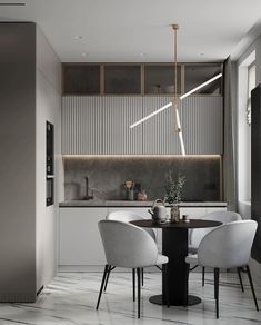 a modern kitchen with white chairs and a round table in the center, surrounded by gray walls