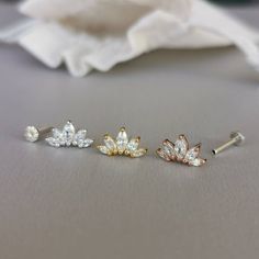 This is a set of a CZ tiara ear piercing jewelry removable end, which has five AAA marquise CZ diamonds, with a threadless push back post.RECOMMENDED WEARING POSITIONEAR PIERCING- Cartilage/Flat - Conch, Inner Conch, Outer Conch- Lobe/Standard Lobe, Upper LobeMATERIAL- AAA Cubic Zirconia- 925 sterling silver with gold/rose gold plated- 925 sterling silver threadless push back postMEASUREMENT* Removable End Size:-- Approximate size : 6.5 mm x 12 mm- CZ size : 1.5 mm x 3 mm, 2 mm x 4 mm, 2.5 mm x Flat Cartilage Piercing, Flat Ear Piercing, Outer Conch Piercing, Outer Conch, Inner Conch, Minimal Earrings Studs, Ear Piercing Jewelry, Upper Lobe, Helix Ear