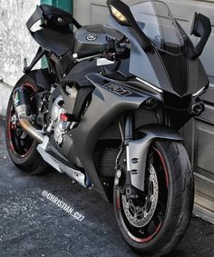 a motorcycle parked in front of a garage door