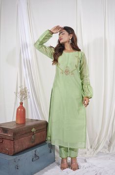 This beautiful kurti with pants is best for all your upcoming occasions. It is exquisitely embellished with thread work. The fabric we use is of premium quality. Length of this dress is 48. If you need any kind of customizations. You can reach us on Instagram @labeltamannarungta. We provide extra margins for alterations (if customer want to resize it to a bigger size). Spring Designer Wear Cotton Silk Dress, Green Semi-stitched Cotton Silk Sharara, Pista Green Straight Kurta For Spring, Spring Designer Cotton Silk Kurta, Green Cotton Silk Sharara With Straight Kurta, Maxi Length Green Kurta With Resham Embroidery, Green Maxi Kurta With Resham Embroidery, Green Maxi Length Kurta With Resham Embroidery, Spring Bollywood Style Cotton Silk Sharara