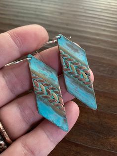 These earrings feature mixed metals of solid, gold brass & raw copper and are finished with a unique turquoise verdigris patina. The patina has been sealed with a good coating of renaissance wax but should not be worn while showering or bathing to maintain patina. The ear wires are forged by hand from 20g Sterling silver. These earrings have a celtic / tribal feel. They are versatile and suitable for just about any style, from modern to rustic. They're substantial but comfortable to wear. Th Modern Viking, 7th Anniversary Gifts, Mixed Metal Earrings, Artisan Earrings, Local Jewelry, Turquoise Green, Geometric Jewelry, Metal Earrings, Mixed Metals